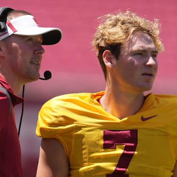 Apr 23, 2022; Los Angeles, CA, USA; Southern California Trojans coach Lincoln Riley (left) talks with quarteback Miller Moss (7) during the spring game at the Los Angeles Memorial Coliseum. Mandatory Credit: Kirby Lee-Imagn Images