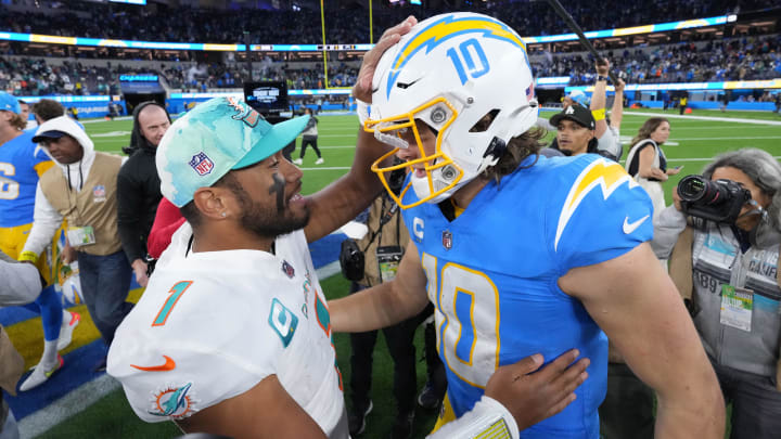 Dec 11, 2022; Inglewood, California, USA; Miami Dolphins quarterback Tua Tagovailoa (1) and Los Angeles Chargers quarterback Justin Herbert (10) shake hands after the game at SoFi Stadium.