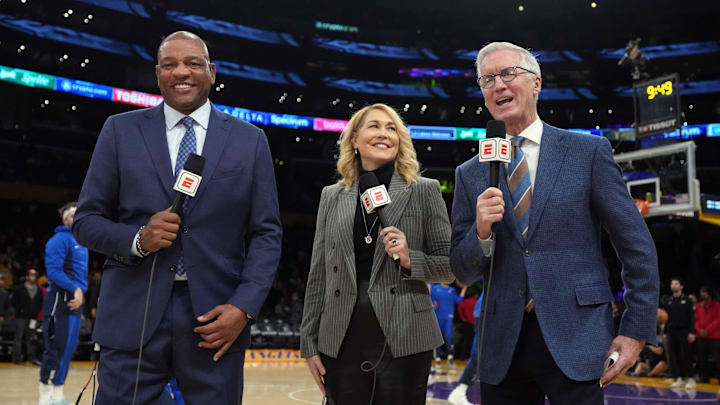 ESPN analysts Doc Rivers, Doris Burke and Mike Breen during a game with the Los Angeles Lakers and the Dallas Mavericks ESPN analysts Doc Rivers, Doris Burke and Mike Breen during a game with the Los Angeles Lakers and the Dallas Mavericks