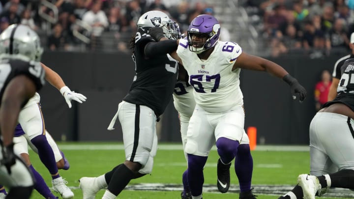 Aug 14, 2022; Paradise, Nevada, USA; Minnesota Vikings guard Ed Ingram (67) defends against Las Vegas Raiders defensive tackle Vernon Butler (94) in the first half at Allegiant Stadium.