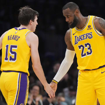 Jan 17, 2024; Los Angeles, California, USA; Los Angeles Lakers forward LeBron James (23) congratulates guard Austin Reaves (15) in the second half against the Dallas Mavericks at Crypto.com Arena. Mandatory Credit: Kirby Lee-USA TODAY Sports