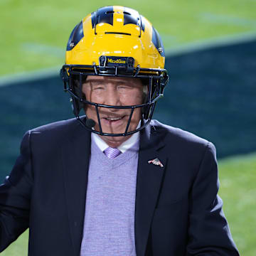 Jan 1, 2024; Pasadena, CA, USA; Lee Corso wears a Michigan Wolverines helmet on the ESPN College Gameday set at the 2024 Rose Bowl college football playoff semifinal game at Rose Bowl. Mandatory Credit: Kirby Lee-Imagn Images