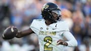 Oct 28, 2023; Pasadena, California, USA; Colorado Buffaloes quarterback Shedeur Sanders (2) throws the ball against the UCLA Bruins in the first half at Rose Bowl.  