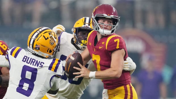 Sep 1, 2024; Paradise, Nevada, USA; Southern California Trojans quarterback Miller Moss (7) is pressured by LSU Tigers safety