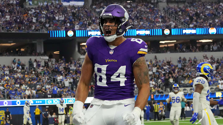 Oct 24, 2024; Inglewood, California, USA; Minnesota Vikings tight end Josh Oliver (84) celebrates after scoring on a 5-yard touchdown pass against the Los Angeles Rams in the first half at SoFi Stadium. Mandatory Credit: Kirby Lee-Imagn Images