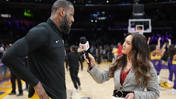 ESPN reporter Cassidy Hubbarth (right) interviews Los Angeles Lakers forward LeBron James.