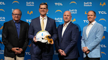 Chargers owner Dean Spanos, head coach Jim Harbaugh, GM Joe Hortiz and president of football operations John Spanos. 