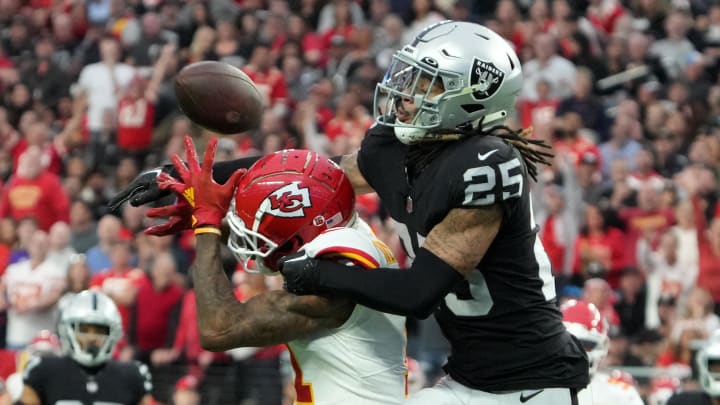 Jan 7, 2023; Paradise, Nevada, USA; Las Vegas Raiders safety Tre'von Moehrig (25) deflects a pass intended for Kansas City Chiefs wide receiver Marquez Valdes-Scantling (11) in the first half at Allegiant Stadium. Mandatory Credit: Kirby Lee-USA TODAY Sports