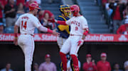 Jun 17, 2024; Anaheim, California, USA; Los Angeles Angels shortstop Zach Neto (9) celebrates with catcher Logan O'Hoppe (14) after hitting a two-run home run in the fourth inning as Milwaukee Brewers catcher Gary Sanchez (99) watches  at Angel Stadium. Mandatory Credit: Kirby Lee-Imagn Images