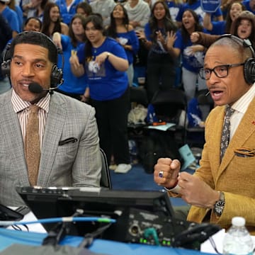 Mar 8, 2025; Los Angeles, California, USA; Fox Sports analyst Jim Jackson (left) and play-by-play announcer Gus Johnson during a game between the UCLA Bruins and the Southern California Trojans at Pauley Pavilion presented by Wescom. Mandatory Credit: Kirby Lee-Imagn Images