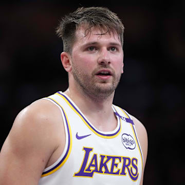 Mar 16, 2025; Los Angeles, California, USA; Los Angeles Lakers guard Luka Doncic (77) reacts against the Phoenix Suns in the second half at Crypto.com Arena. Mandatory Credit: Kirby Lee-Imagn Images