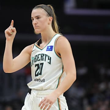 Aug 28, 2024; Los Angeles, California, USA; New York Liberty guard Sabrina Ionescu (20) gestures against the LA Sparks in the first half at Crypto.com Arena. Mandatory Credit: Kirby Lee-Imagn Images