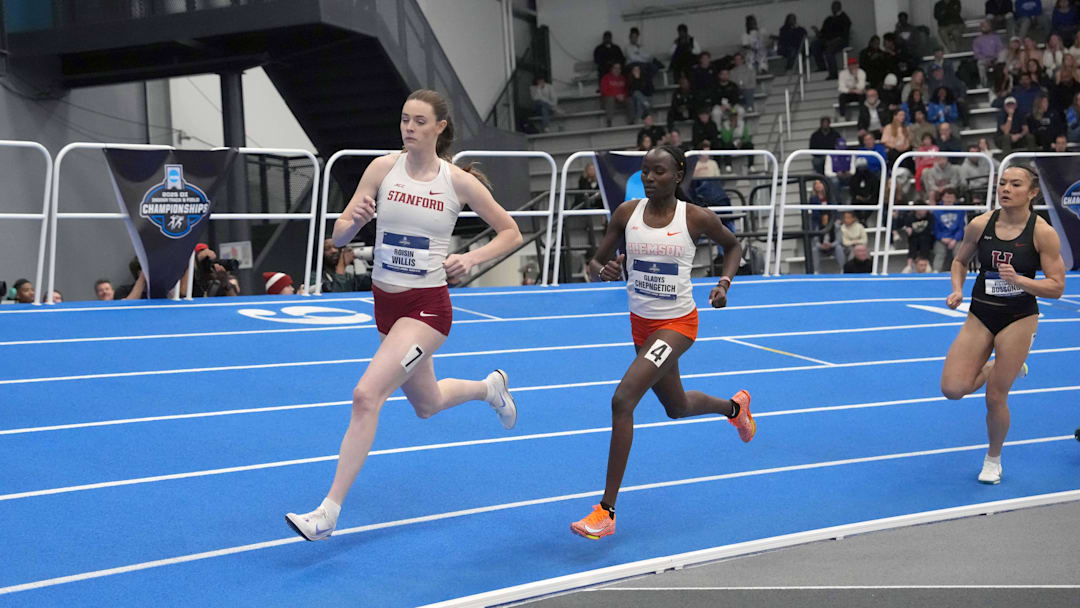 Roisin Willis of Stanford and Gladys Chepngetich of Clemson run in a women's 800m heat during the NCAA Indoor Championships at the Virginia Beach Sports Center. 