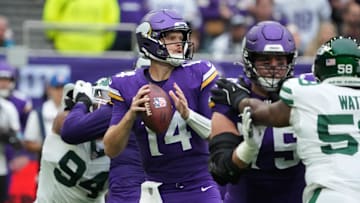 Oct 6, 2024; London, United Kingdom; Minnesota Vikings quarterback Sam Darnold (14) throws the ball against the New York Jets in the first half at Tottenham Hotspur Stadium. Mandatory Credit: Kirby Lee-Imagn Images
