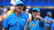 Los Angeles Chargers coach Jim Harbaugh and general manager Joe Hortiz.