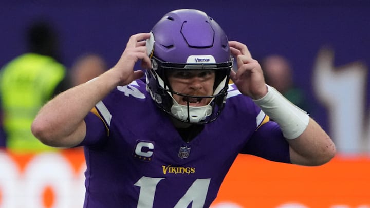 Oct 6, 2024; London, United Kingdom; Minnesota Vikings quarterback Sam Darnold (14) prepares to take the snap against the New York Jets in the first half at Tottenham Hotspur Stadium. Mandatory Credit: Kirby Lee-Imagn Images