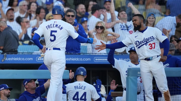 Jun 15, 2024; Los Angeles, California, USA; Los Angeles Dodgers first baseman Freddie Freeman (5) is congratulated by left fielder Teoscar Hernandez (37) after scoring in the fourth inning against the Kansas City Royals at Dodger Stadium. Mandatory Credit: Kirby Lee-USA TODAY Sports