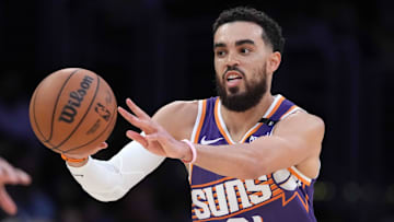 Mar 16, 2025; Los Angeles, California, USA; Phoenix Suns guard Tyus Jones (21) passes the ball against the Los Angeles Lakers in the second half at Crypto.com Arena. Mandatory Credit: Kirby Lee-Imagn Images