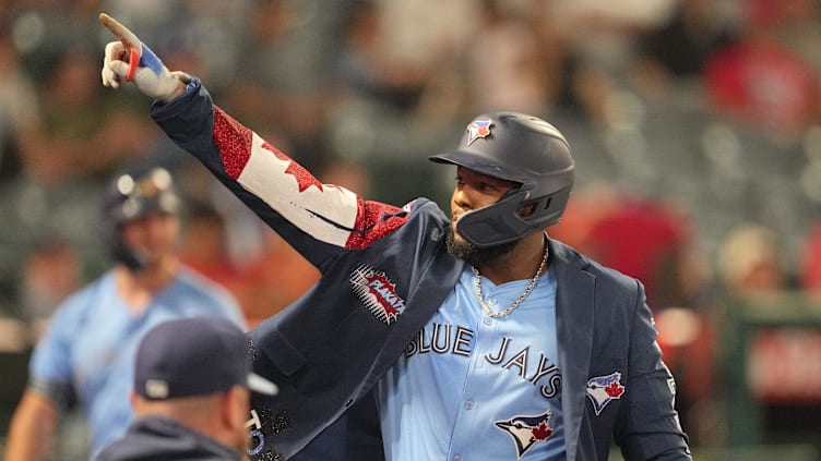 Aug 14, 2024; Anaheim, California, USA; Toronto Blue Jays first baseman Vladimir Guerrero Jr. (27) celebrates after hitting a two-run home run in the eighth inning at Angel Stadium. Mandatory Credit: Kirby Lee-USA TODAY Sports