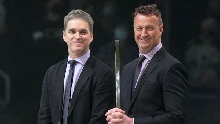 Feb 15, 2022; Los Angeles, California, USA; LA Kings president Luc Robitaille (left) and general manager Rob Blake react during the game against the Edmonton Oilers at Crypto.com Arena. Mandatory Credit: Kirby Lee-Imagn Images
