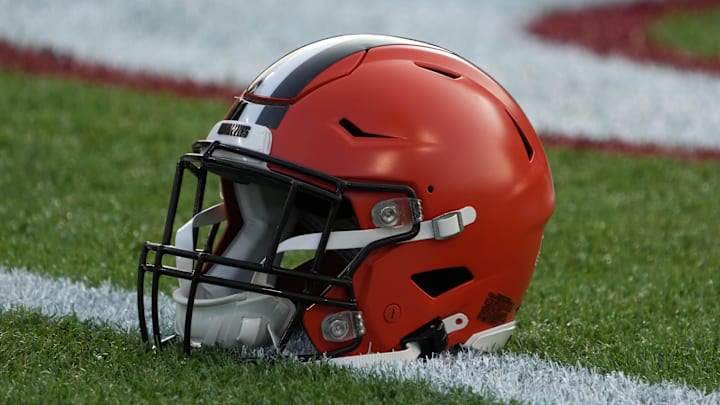 A Cleveland Browns helmet on the field at Tom Benson Hall of Fame Stadium. A Cleveland Browns helmet on the field at Tom Benson Hall of Fame Stadium.