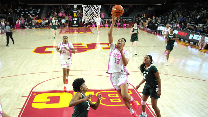 Feb 19, 2025; Los Angeles, California, USA; Southern California Trojans guard JuJu Watkins (12) shoots the ball against Michigan State Spartans guard Nyla Hampton (22) and guard Jocelyn Tate (11) in the second half at the Galen Center. Mandatory Credit: Kirby Lee-Imagn Images Feb 19, 2025; Los Angeles, California, USA; Southern California Trojans guard JuJu Watkins (12) shoots the ball against Michigan State Spartans guard Nyla Hampton (22) and guard Jocelyn Tate (11) in the second half at the Galen Center. Mandatory Credit: Kirby Lee-Imagn Images