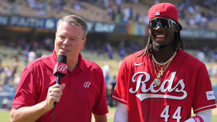 Bally Sports reporter Jim Day (left) interviews Cincinnati Reds shortstop Elly De La Cruz