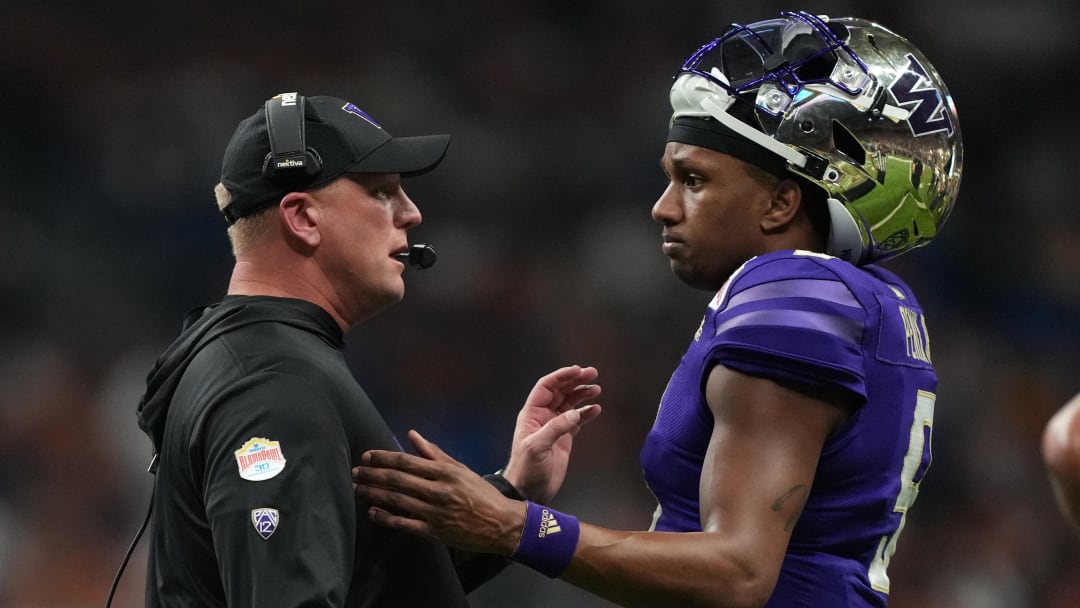 Dec 29, 2022; San Antonio, Texas, USA; Washington Huskies head coach Kalen DeBoer (left) talks with quarterback Michael Penix Jr. (9) in the first half of the 2022 Alamo Bowl against the Texas Longhorns at Alamodome. Mandatory Credit: Kirby Lee-USA TODAY Sports