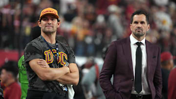 Dec 2, 2022; Las Vegas, NV, USA; Southern California Trojans former quarterbacks Mark Sanchez (left) and Matt Leinart watch from the sidelines during the Pac-12 Championship game against the Utah Utes at Allegiant Stadium. Mandatory Credit: Kirby Lee-Imagn Images