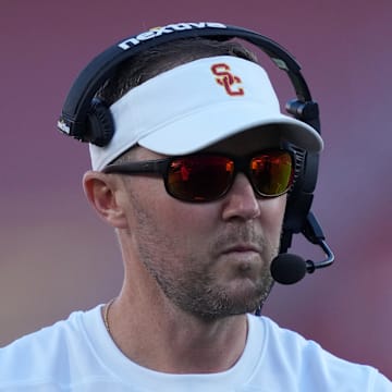 Oct 21, 2023; Los Angeles, California, USA; Southern California Trojans head coach Lincoln Riley watches from the sidelines against the Utah Utes in the first half at United Airlines Field at Los Angeles Memorial Coliseum. Mandatory Credit: Kirby Lee-Imagn Images