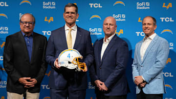 Feb 1, 2024; Inglewood, CA, USA; Los Angeles Chargers coach Jim Harbaugh (second from right) poses