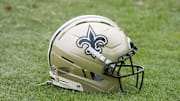 Aug 14, 2025; Carson, CA, USA; A New Orleans Saints helmet on the field during a joint practice against the Los Angeles Rams at the Dignity Health Sports Park. Mandatory Credit: Kirby Lee-Imagn Images