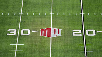 The Mountain West conference logo on the field at Allegiant Stadium. 