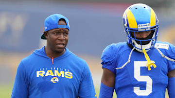 Aug 18, 2021; Thousand Oaks, CA, USA; Los Angeles Rams defensive coordinator Raheem Morris (left) and cornerback Jalen Ramsey (5) react during a joint practice against the Las Vegas Raiders. Mandatory Credit: Kirby Lee-Imagn Images