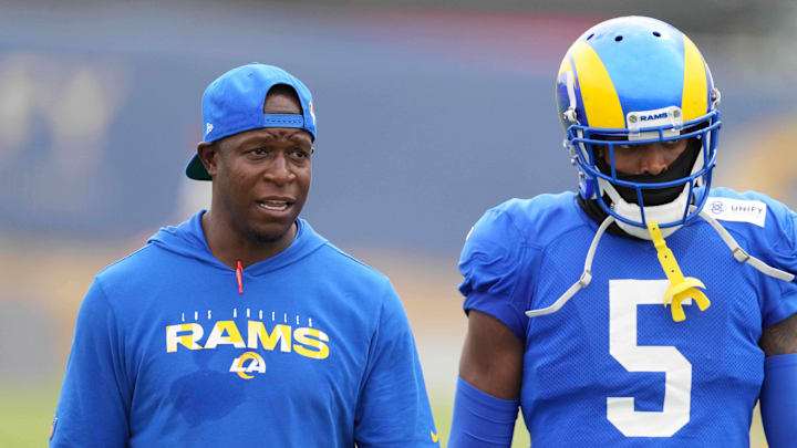 Aug 18, 2021; Thousand Oaks, CA, USA; Los Angeles Rams defensive coordinator Raheem Morris (left) and cornerback Jalen Ramsey (5) react during a joint practice against the Las Vegas Raiders. Mandatory Credit: Kirby Lee-Imagn Images