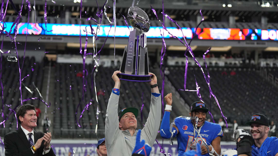 Dec 2, 2023; Las Vegas, NV, USA; Boise State Broncos head coach Spencer Danielson holds the Craig Thompson tropny after 44-20 victory over the UNLV Rebels in the Mountain West Championship at Allegiant Stadium. Mandatory Credit: Kirby Lee-Imagn Images