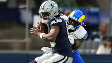 Dallas Cowboys quarterback Joe Milton III is sacked by Los Angeles Rams linebacker Josaiah Stewart