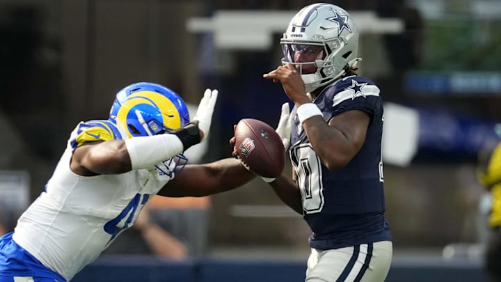 Dallas Cowboys quarterback Joe Milton III is sacked by Los Angeles Rams linebacker Josaiah Stewart.