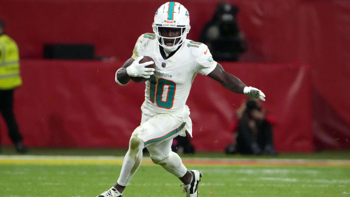 Nov 5, 2023; Frankfurt, Germany; Miami Dolphins wide receiver Tyreek Hill (10) carries the ball against the Kansas City Chiefs in the second half during an NFL International Series game at Deutsche Bank Park. Mandatory Credit: Kirby Lee-USA TODAY Sports