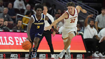 Nov 4, 2024; Los Angeles, California, USA; Chattanooga Mocs guard Honor Huff (3) dribbles the ball against Southern California Trojans guard Clark Slajchert (32) in the second half at Galen Center. Mandatory Credit: Kirby Lee-Imagn Images