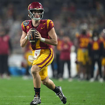 Dec 27, 2023; San Diego, CA, USA; Southern California Trojans quarterback Miller Moss (7) throws the ball against the Louisville Cardinalsin the first half of the Holiday Bowl at Petco Park. Mandatory Credit: Kirby Lee-Imagn Images