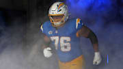 Sep 8, 2024; Inglewood, California, USA; Los Angeles Chargers offensive tackle Joe Alt (76) enters the field before the game against the Las Vegas Raiders at SoFi Stadium. Mandatory Credit: Kirby Lee-Imagn Images