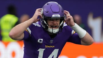 Oct 6, 2024; London, United Kingdom; Minnesota Vikings quarterback Sam Darnold (14) prepares to take the snap against the New York Jets in the first half at Tottenham Hotspur Stadium. Mandatory Credit: Kirby Lee-Imagn Images