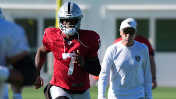 Jul 24, 2025; Henderson, NV, USA; Las Vegas Raiders quarterback Geno Smith (7) with coach Pete Carroll during training camp at the Intermountain Healthcare Performance Center.