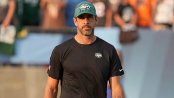 Aug 3, 2023; Canton, Ohio, USA; New York Jets quarterback Aaron Rodgers (8) watches from the sidelines during the first half against the Cleveland Browns at Tom Benson Hall of Fame Stadium.