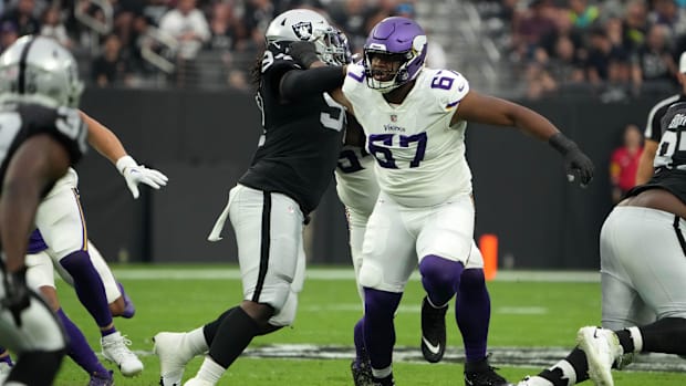 Vikings guard Ed Ingram (67) blocks a Raiders defensive tackle in the first half of an NFL game at Allegiant Stadium in 2022.