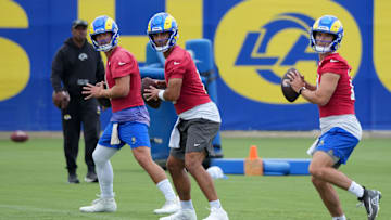 Los Angeles Rams quarterbacks Matthew Stafford, Jimmy Garoppolo and Stetson Bennett throw during organized NFL activities