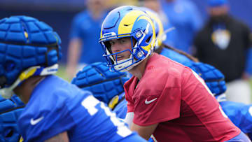 May 28, 2025; Woodland Hills, CA, USA; Los Angeles Rams quarterback Matthew Stafford (9) prepares to take the snap during organized team activities at Rams Practice Facility. Mandatory Credit: Kirby Lee-Imagn Images