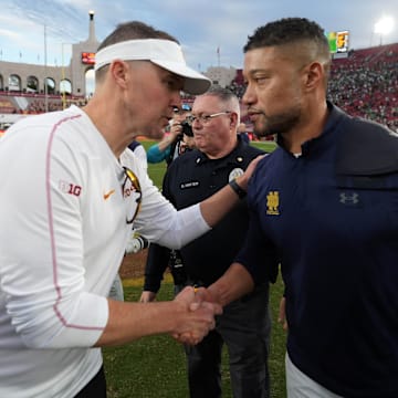 Trojans coach Lincoln Riley and Irish coach Marcus Freeman shake hands after the 2024 game.