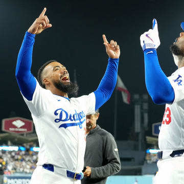Jun 11, 2024; Los Angeles, California, USA; Los Angeles Dodgers right fielder Jason Heyward (23) celebrates with left fielder Teoscar Hernandez (37) after hitting a two-run home run in the sixth inning against the Texas Rangers at Dodger Stadium.